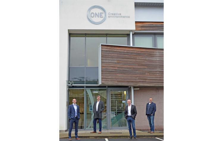 Directors with the new branding outside Worcester HQ